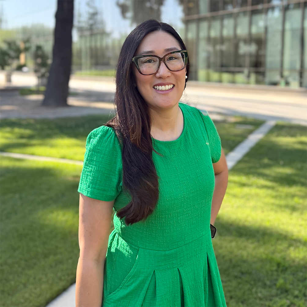 Advisor, Jessica McVay, standing in front of the Fresno State library.