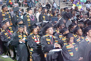 The Class of 2003 Proudly Shows Off Their Earned Kente Stoles 