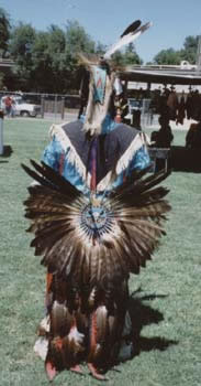 The back of an American Indian Male Wearing Cultural Attire