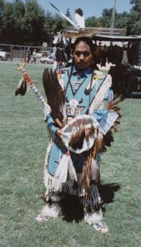 The Front of an American Indian Male Wearing Cultural Attire at the Pow Wow