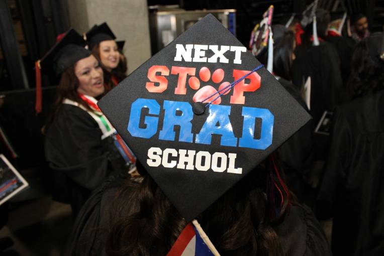 Decorative graduation cap that says "Next stop: Grad School"