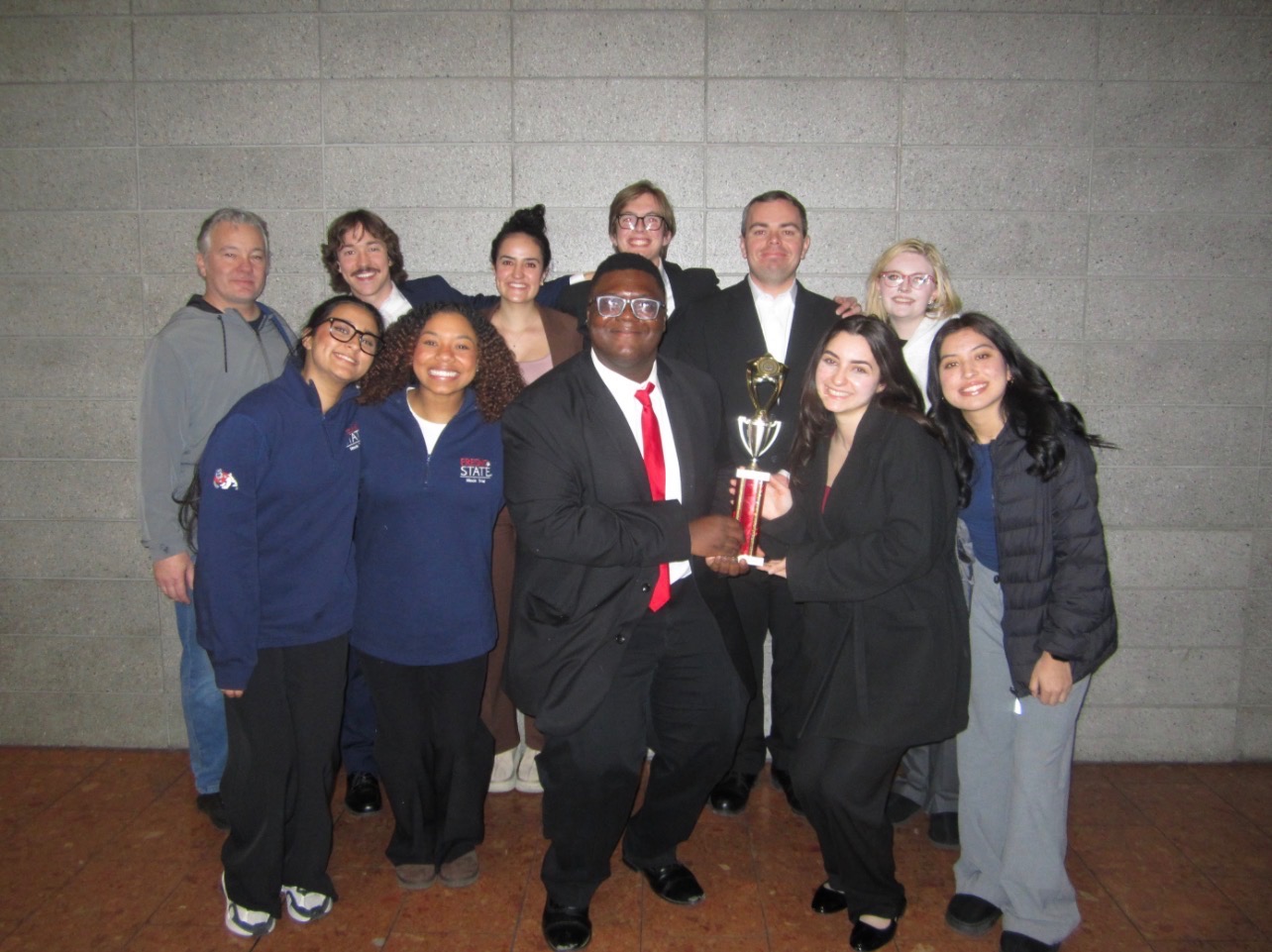 Mock Trial students holding a trophy