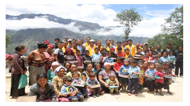 people sitting and standing posing Rasuwa, Nepal for Tamang community