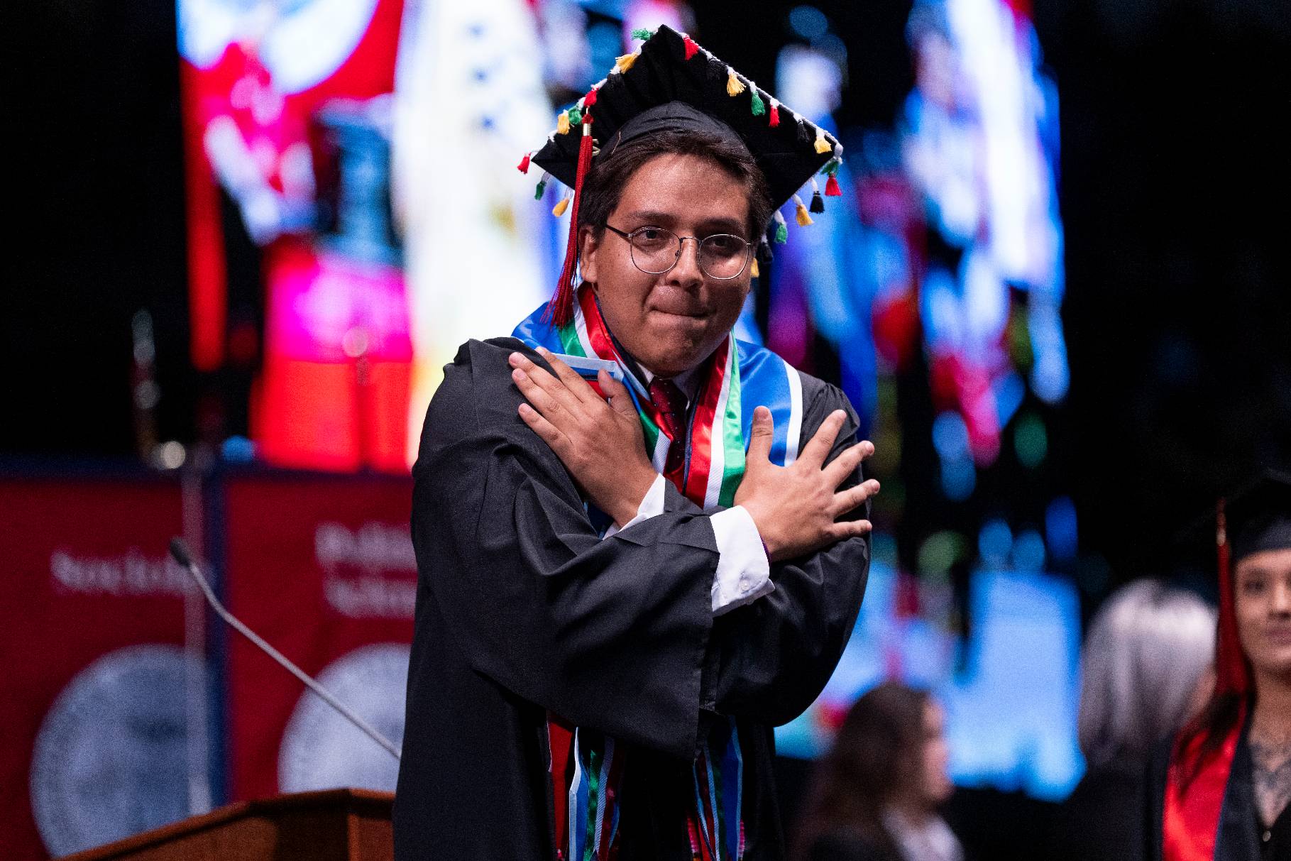 Male commencement student bowing down