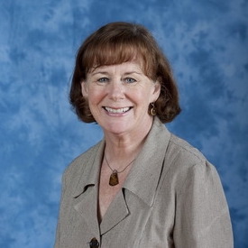Diane Johnson against a blue background
